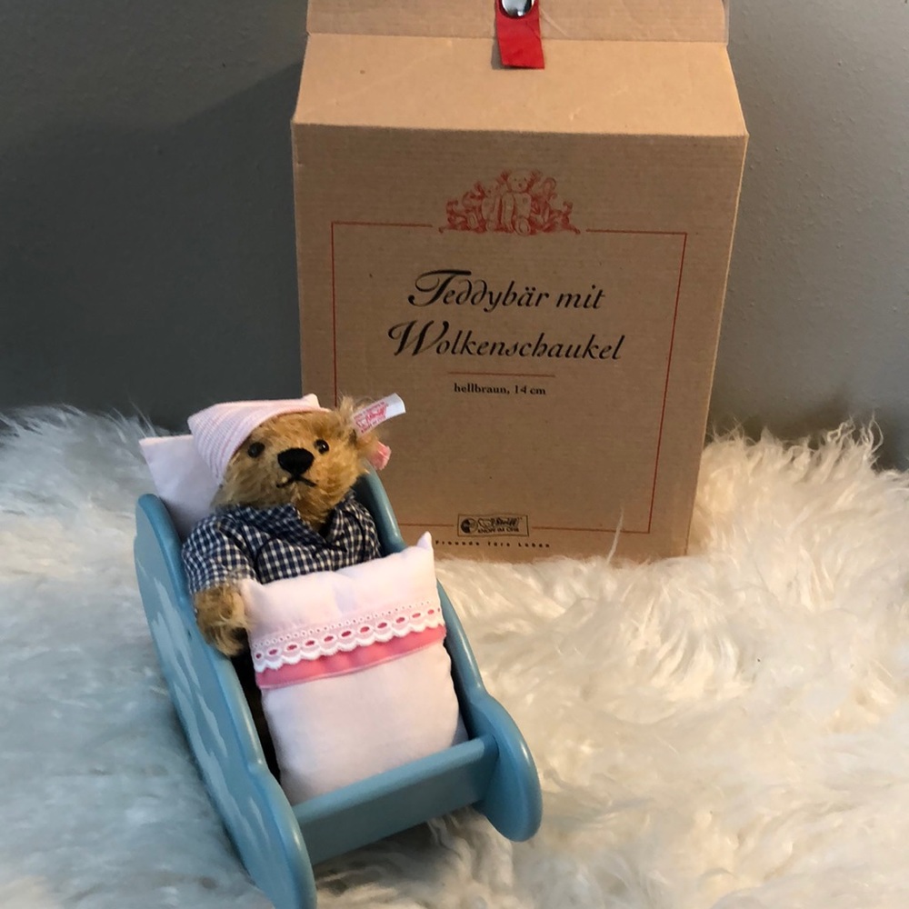 Steiff teddy bear with a cloud cradle